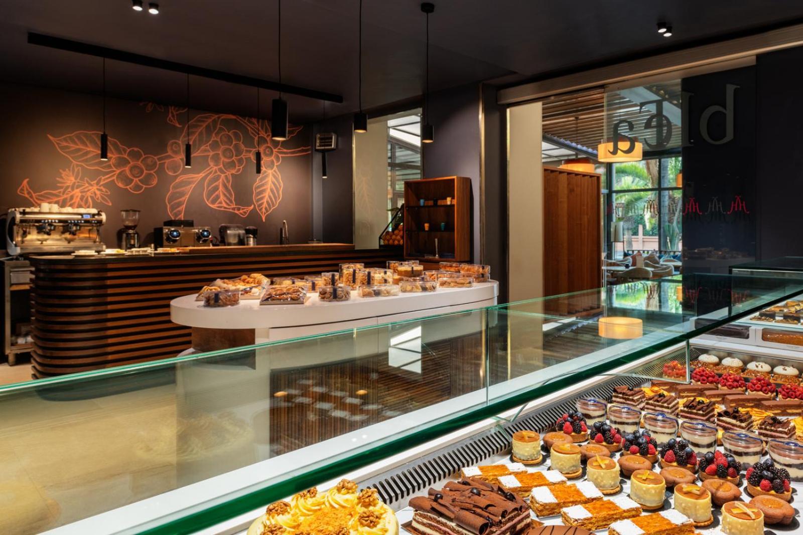 Hivernage Hotel & Spa Marrakesh Exterior photo The interior of a Starbucks Reserve store in Milan, Italy